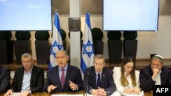 Israeli Prime Minister Benjamin Netanyahu (2ndL) chairs a Cabinet meeting, attended by National Security Minister Itamar Ben Gvir (2ndR), at the Kirya, which houses the Israeli Ministry of Defence, in Tel Aviv on December 31, 2023.