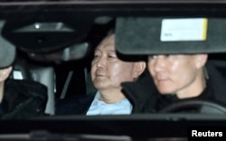 A motorcade carrying South Korea's impeached president, Yoon Suk Yeol, leaves for the Seoul Detention Center at the Corruption Investigation Office for High-ranking Officials following his arrest, in Gwacheon, South Korea, on Jan. 15, 2025. (Yonhap via Reuters)