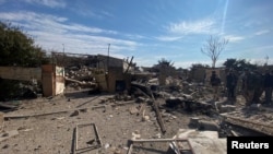 A destroyed building is pictured at the site of a U.S. airstrike in al-Qaim, Iraq, on Feb. 3, 2024.