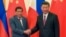 FILE - Philippine President Rodrigo Duterte, left, and Chinese President Xi Jinping pose for photographers on the sidelines of the Belt and Road Forum for International Cooperation at the Great Hall of the People in Beijing, May 15, 2017. 