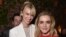 When actors January Jones, left, and Kiernan Shipka posed for this photo at the AMC Holiday Party in West Hollywood, California, on Nov. 13, 2014, a wide-eyed prankster photobombed them.