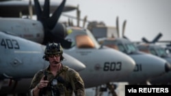 Aircraft carrier USS Ronald Reagan (CVN 76) responds to a call for assistance from the Mercer Street, a Japanese-owned Liberian-flagged tanker managed by Israeli-owned Zodiac Maritime, in the Arabian Sea, July 30, 2021.