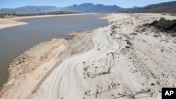 FILE - The Theewaterskloof Dam, a key source of water supply to Cape Town, South Africa, is shown at low levels, April 16, 2017. 