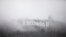 FILE: The Hollywood sign is seen through a mix of fog and dust snow during a rare cold winter storm in the Los Angeles area, in Los Angeles, California, on Feb. 24, 2023.