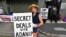 FILE - Anti-Adani coal mine protestor Rae Sheridan is seen outside the LNP (Liberal National Party) headquarters in Brisbane, April 11, 2019. The protestors are trying to stop the building of Adani's Carmichael coal mine. 