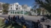 Journalists gather outside the Supreme Court of Haiti (Cours de cassation)on February 8, 2021 in the almost empty streets of Port-au-Prince.