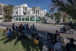 Journalists gather outside the Supreme Court of Haiti (Cours de cassation)on, Feb. 8, 2021 in the almost empty streets of Port-au-Prince.