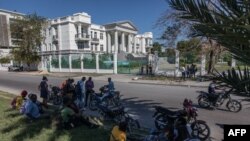 Journalists gather outside the Supreme Court of Haiti (Cours de cassation)on February 8, 2021 in the almost empty streets of Port-au-Prince.