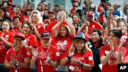 FILE - Culinary Union members cheer as they rally in support of Democratic candidates at the culinary union hall in Las Vegas, Nov. 5, 2018.