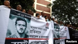 FILE - Teachers make a human chain to protest the murder of Abrar Fahad, a student of Bangladesh University of Engineering and Technology in Dhaka, Oct. 9, 2019.