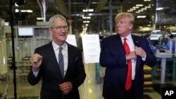 Apple CEO Tim Cook and President Donald Trump speak during a tour of an Apple manufacturing plant, Nov. 20, 2019, in Austin. 