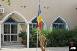 A Chad national flag flies at half staff outside a building on April 21, 2021, after Chad's President Idriss Deby Itno died on April 20, 2021, from wounds suffred in battle after three decades in power.