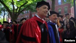 Honorary degree recipient actor Tom Hanks walks between graduating students during Harvard University’s 372nd Commencement Exercises in Cambridge, Massachusetts, May 25, 2023. 