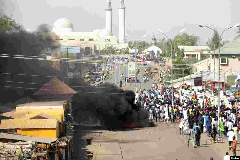 Smoke is seen after an suicide bomb explosion in Gombe a day ahead of Nigeria&#39;s President Goodluck Jonathan&#39;s visit to the state for an election campaign rally.
