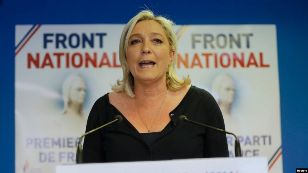 Marine Le Pen, France's National Front political party head, reacts to results after the polls closed in the European Parliament elections at the party's headquarters in Nanterre, near Paris, May 25, 2014. 