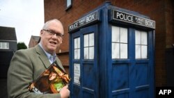 Dr Who fan Tony Jordan poses for a photograph with his TARDIS in the garden of his home in Cannock, central England on Nov. 21, 2023.