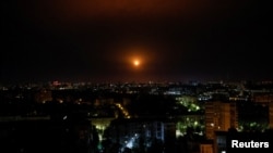 An explosion of a missile is seen in the sky over the city during a Russian missile strike, amid Russia's attack on Ukraine, in Kyiv, Ukraine May 16, 2023.