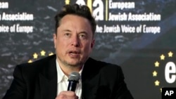 FILE - Elon Musk addresses the European Jewish Association's conference in Krakow, Poland, Jan. 22, 2024.