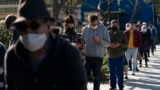 People wait in line for a COVID-19 test in Los Angeles, California, Jan. 4, 2022.