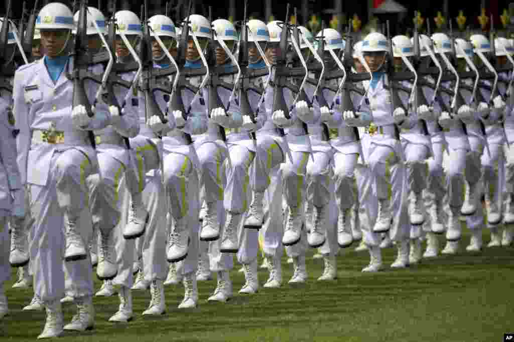 Members of Indonesian Navy take part in a flag hoisting ceremony held to commemorate the country' 73rd anniversary of independence at Merdeka Palace in Jakarta, Indonesia.