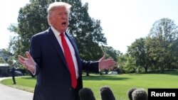 U.S. President Donald Trump talks to reporters as he departs for travel to New York and New Jersey from the South Lawn of the White House in Washington, Aug. 9, 2019.