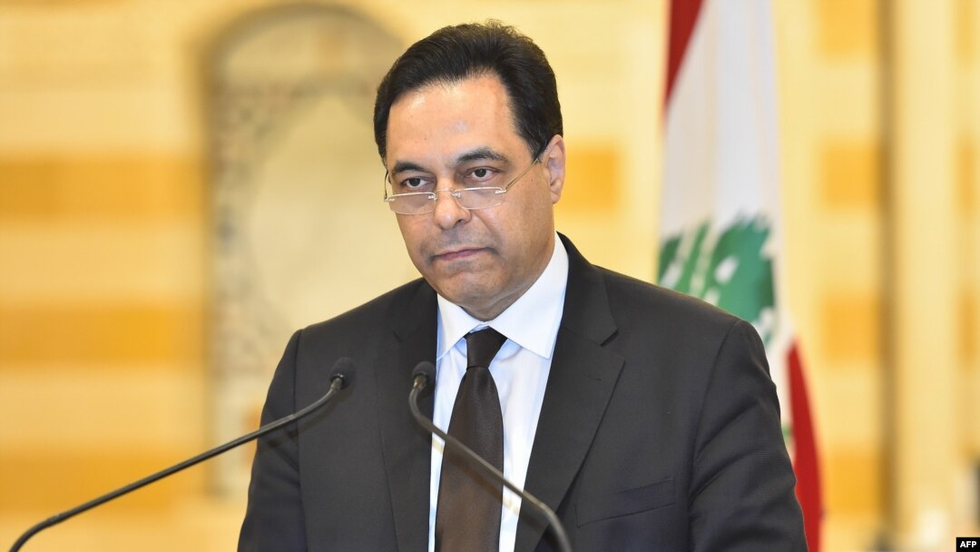 A handout picture provided by the Lebanese photo agency Dalati and Nohra, Aug. 10, 2020 shows Prime Minister Hassan Diab announcing his government's resignation amid popular outrage over the deadly Beirut port explosion.