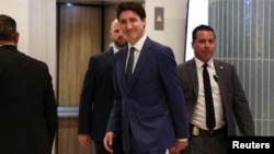 Canada's Prime Minister Justin Trudeau leaves a hotel in West Palm Beach, Florida, en route to meet U.S. President-elect Donald Trump at his Mar-a-Lago resort, Nov. 29, 2024.