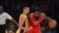 James Harden of the Houston Rockets (R) is guarded by Jeremy Lin #17 of the Los Angeles Lakers during the Lakers first regular season NBA game against the Houston Rockets, October 28, 2014 at Staples Center in Los Angeles, California. AFP PHOTO / Robyn B