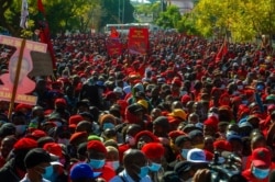 Members of the Economic Freedom Fighters stage a protest march in Pretoria, South Africa, June 25, 2021, demanding that vaccines from China and Russia be included in the country's vaccine rollout program.