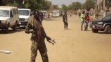 FILE - A soldier from South Sudan's army stands guard in Malakal in the Upper Nile State of South Sudan, Dec. 31, 2013.