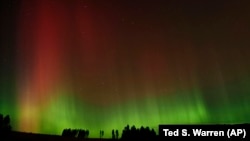 FILE - An aurora borealis, also known as the northern lights, is seen in the night sky along with the Big Dipper constellation on Thursday, Oct. 10, 2024, in Moscow, Idaho. (AP Photo/Ted S. Warren)