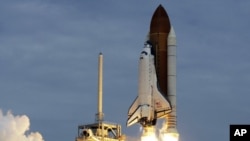 The space shuttle Atlantis lifts off from the Kennedy Space Center, July 8, 2011, in Cape Canaveral, Florida