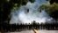 Riot police take position while clashing with opposition supporters during a rally against President Nicolas Maduro in Caracas, Venezuela, May 4, 2017. 