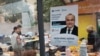 A campaign poster for Uzbekistan's legislative elections is seen at Tashkent's Chorsu Bazaar, Oct. 27, 2024. 