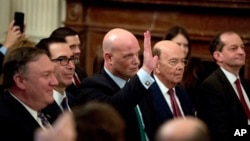 Acting United States Attorney General Matt Whitaker waves as he is recognized by President Donald Trump during a Medal of Freedom ceremony in the East Room of the White House in Washington, Nov. 16, 2018. 