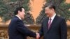 Chinese President Xi Jinping, right, shakes hands with former Taiwanese President Ma Ying-jeou as they meet in Beijing on April 10, 2024, in a bid to promote unification between the sides that separated amid civil war in 1949. (Xinhua News Agency via AP)