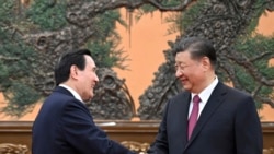 China's Xi tells ex-Taiwan leader 'external interference' cannot block unification.