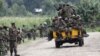 M23 rebel fighters sit on a truck as they prepare to withdraw near the town of Sake, 42 kilometers west of Goma in eastern Congo, November 30, 2012.