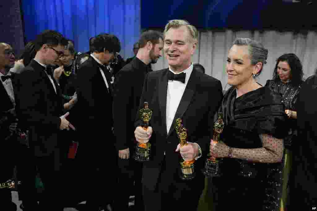 Christopher Nolan, winner of the awards for best director and best picture for &quot;Oppenheimer,&quot; left, and Emma Thomas, winner of the award for best picture for &quot;Oppenheimer&quot; pose at the Governors Ball after the Oscars on March 10, 2024, at the Dolby Theatre in Los Angeles.