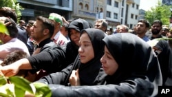 Iranians attend the funeral of victims of an Islamic State militant attack, in Tehran, Iran, June 9, 2017. Attacks this week, claimed by Islamic State, killed 17 people. 