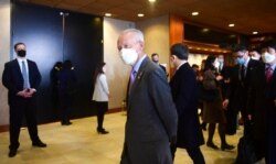 FILE - China's Ambassador to the U.S. Cui Tiankai walks past the closed-door morning session of U.S.-China talks in Anchorage, Alaska, March 19, 2021.