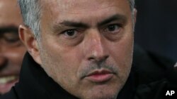 Chelsea Manager José Mourinho looks across the pitch before the Champions League Group G soccer match between Chelsea and Sporting Lisbon at Stamford Bridge in London, Wednesday, Dec. 10, 2014. (AP Photo/Tim Ireland)