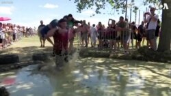 Hungarians Participate in Wife-Carrying Race 