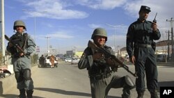 Afghan police keep watch at a checkpoint in Kabul, April 10, 2012.