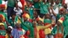 FILE — Cameroon supporters cheer during the 2023 Africa Cup of Nations group C football match against Gambia that was being held at Stade de la Paix in Bouake, Ivory Coast, Jan. 23, 2024.