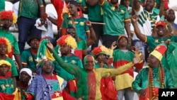 FILE — Cameroon supporters cheer during the 2023 Africa Cup of Nations group C football match against Gambia that was being held at Stade de la Paix in Bouake, Ivory Coast, Jan. 23, 2024.