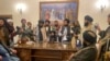 FILE - Taliban fighters take control of the Afghan presidential palace after President Ashraf Ghani fled the country, in Kabul, Afghanistan, Aug. 15, 2021.