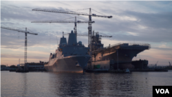 Naval ships sit at a maintenance and repair facility in Norfolk, Virginia. (Mary Cieslak/VOA)