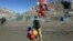 A young boy sells balloons in Kabul, March 23, 2017. An aid group said Thursday that nearly a third of all children in war-torn Afghanistan are unable to attend school, leaving them at increased risk of child labor, recruitment by armed groups, early marriage and other forms of exploitation. 