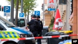 Police officers are seen at a crime scene in Halle, Germany, Oct. 9, 2019. 